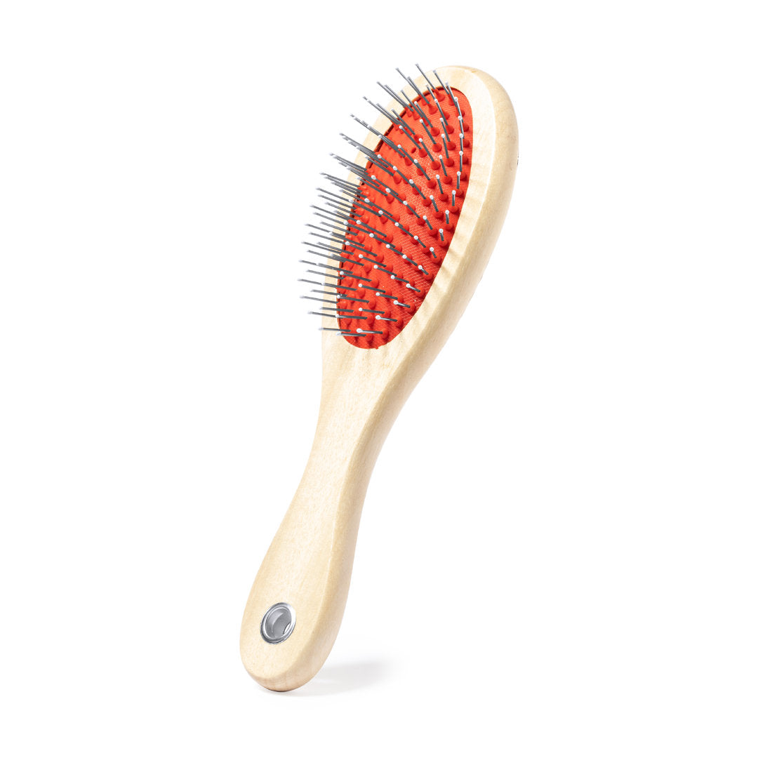 Brosse double-face en bois naturel pour animaux de compagnie.