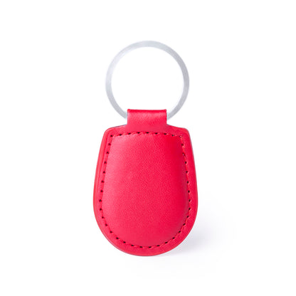Porte-clés élégant avec une finition en similicuir, disponible dans des couleurs variées.