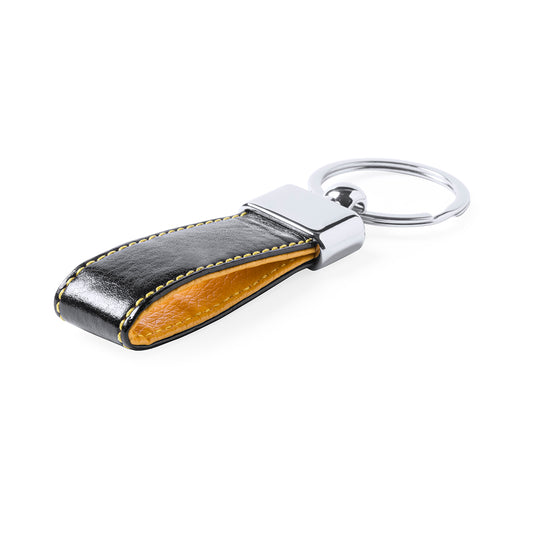 Porte-clés élégant en similicuir bicolore avec accessoire métallique.