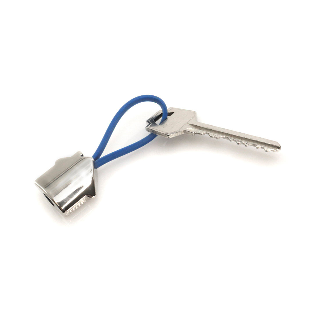 Accessoire porte-clés avec maison en métal en 3D. Personnalisable - Lien en caoutchouc varié.