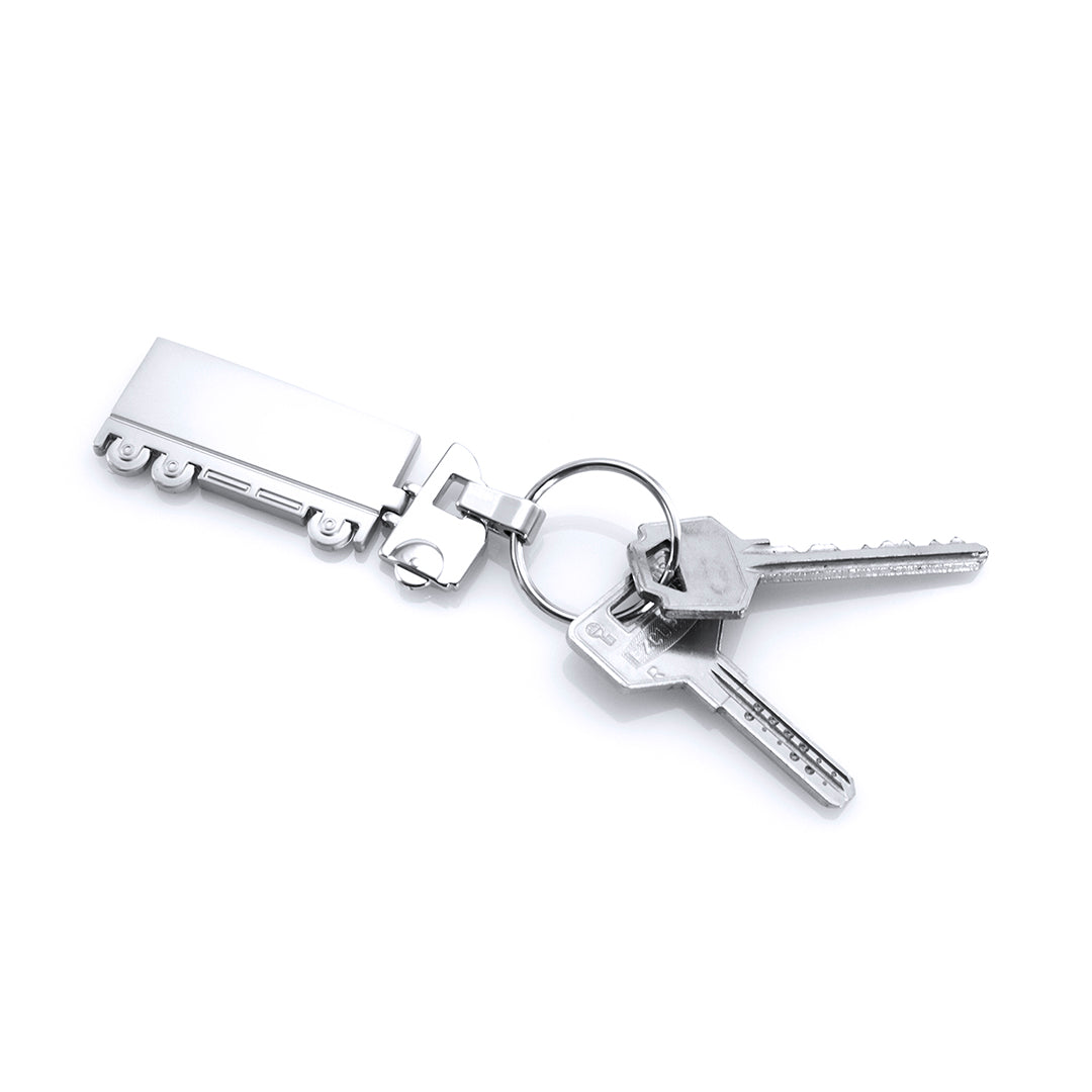 Porte-clés en métal avec cabine brillante et remorque mate, personnalisable pour un effet moderne. Accessoire pratique.