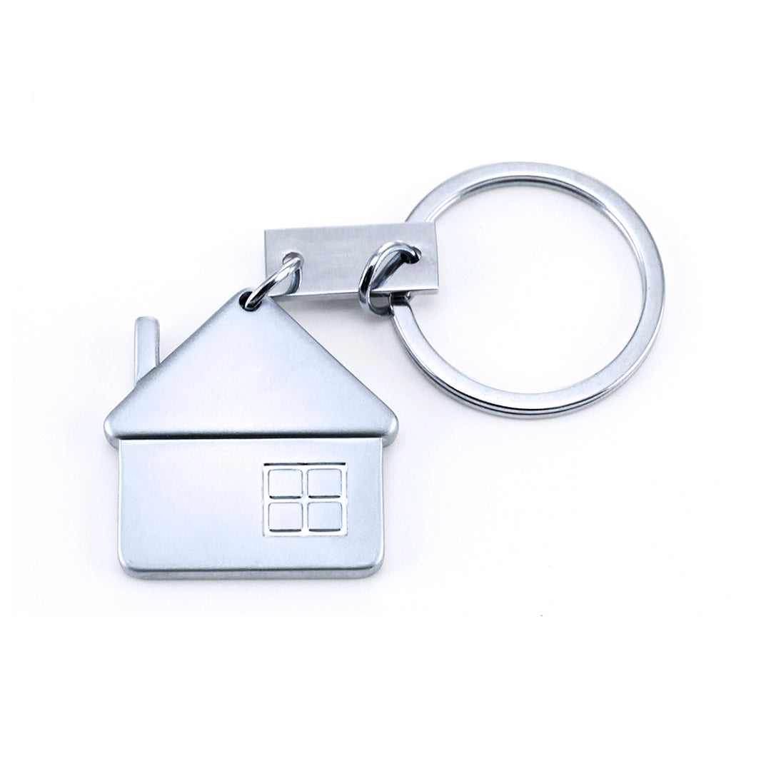 Accessoire porte-clés métallique en forme de maison avec finition mate. Personnalisable.