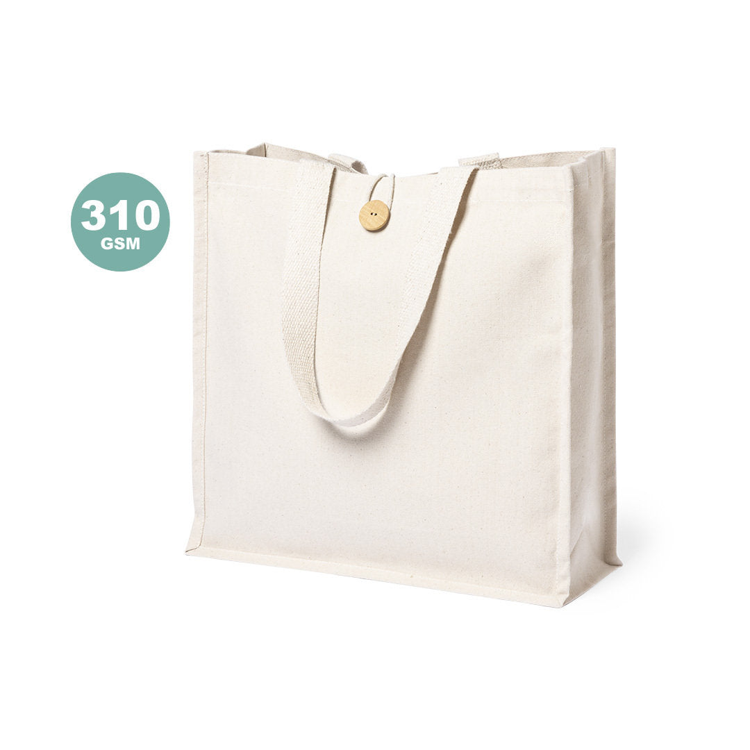 Sac en matière 100% coton avec finition en couleur naturelle. Avec poignées longues de 70cm et finition cousue. Résistance jusqu’à 7kg de poids. 100% Coton 105 g/ m personnalisable logo marque