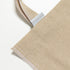 totebag Poignées longues de 70 cm avec finition cousue, pour une résistance jusqu'à 9 kg.
