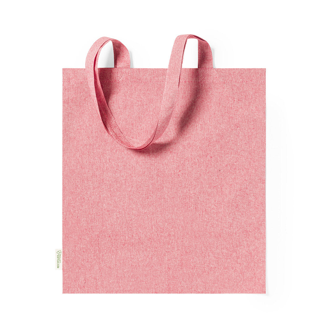tote bag Comporte une étiquette distinctive avec badge en coton recyclé, soulignant son origine durable.