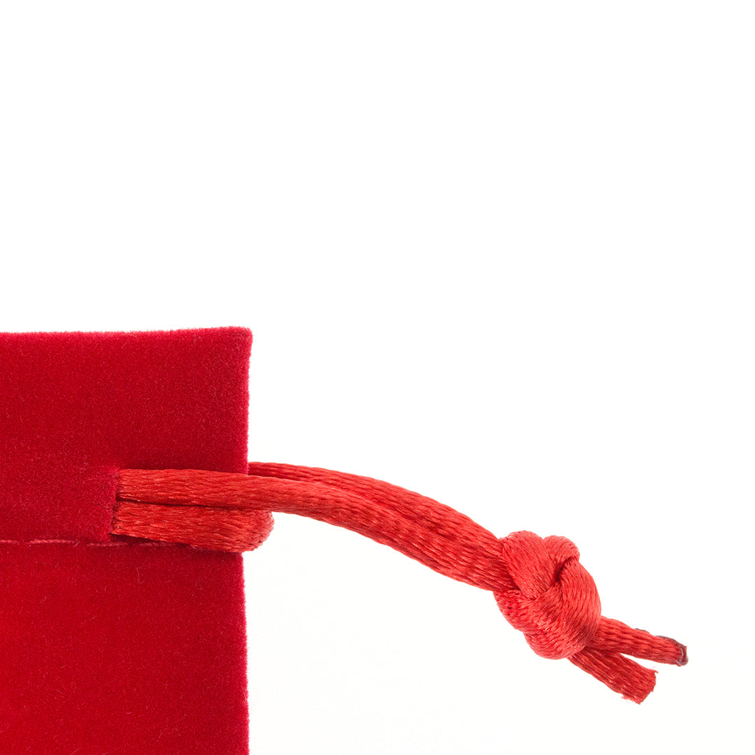 Sac en suédine douce, fermeture par cordon, coloris assortis disponibles.